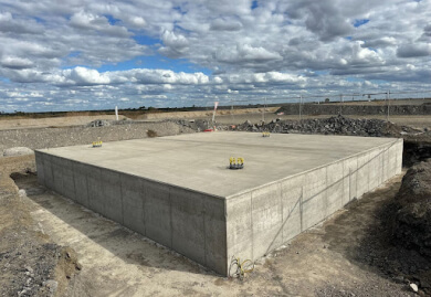 Concrete foundation structure at a construction site, showcasing Slamm Services' expertise in civil engineering and foundation work. Concrete foundation structure at a construction site, showcasing Slamm Services' expertise in civil engineering and foundation work.
