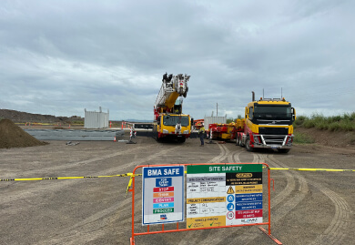 Construction site with safety signage and heavy machinery, highlighting Slamm Services' expertise in road signage and traffic management solutions. Construction site with safety signage and heavy machinery, highlighting Slamm Services' expertise in road signage and traffic management solutions.
