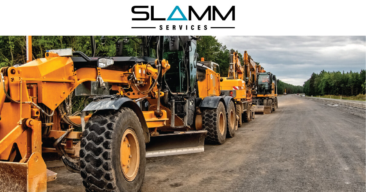 Row of heavy machinery on a construction site, representing Slamm Services' commitment to equipment hire and support for local contractors.